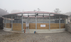 Round walker with rail gliding mechanism, fenced with softwood and round metal pipes on top